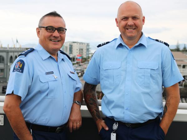 Sergeant Grant Pigott, right, with Inspector Sam Aberahama.