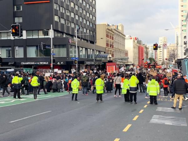 Māori and Pacific Wardens march with the protestors in Queen Street. 