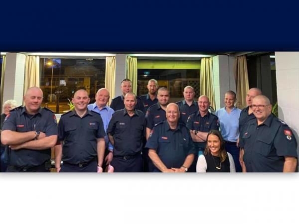 Olivia and the volunteer fire crew with hardworking hairdresser Joss.