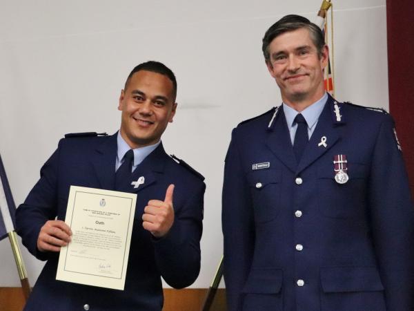 It's a Rob Lemoto thumbs up from Tyrone as he is attested by Commissioner Andrew Coster. 