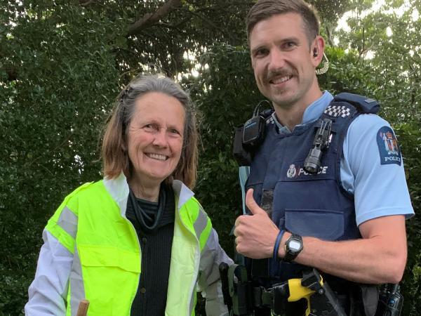 Constable Josh Furze with Catherine Martin in her new high-vis vest. 