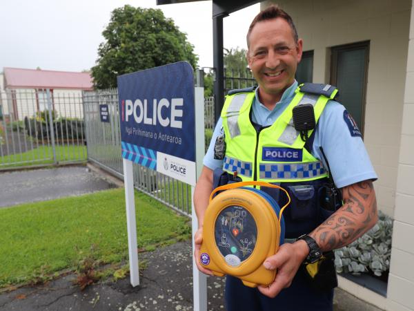 Constable Nick Preston with the defibrillator he sourced for police in Te Aroha.