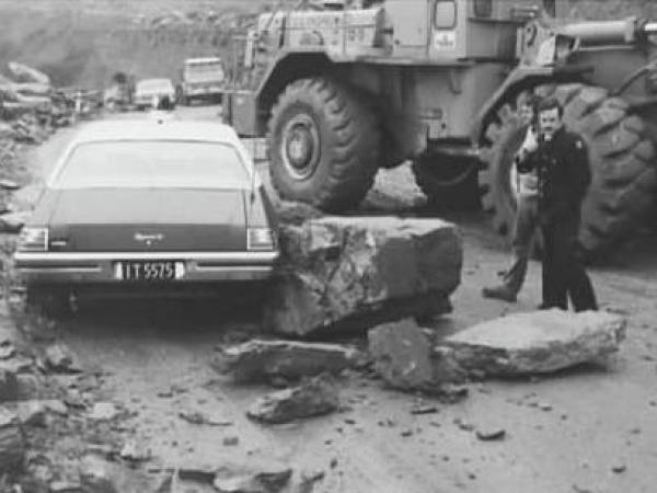 Murray Stapp next to rubble that had fallen down onto his vehicle. 