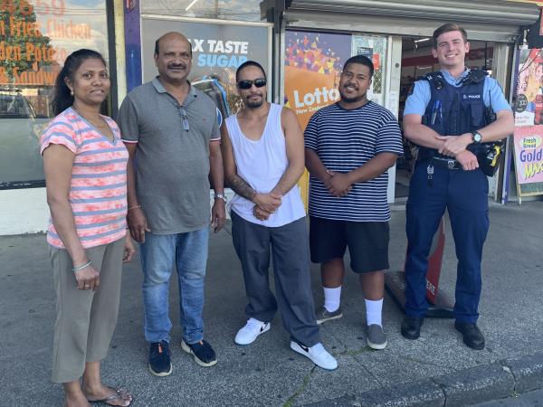 L-R: The owners of the dairy, two of the members of the public who helped stop the offender, and a Waitemata West officer.