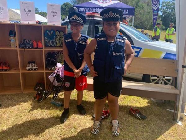 Tamariki receive a pair of pre-loved footy boots.