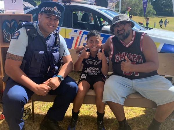 Tamariki receive a pair of pre-loved footy boots.