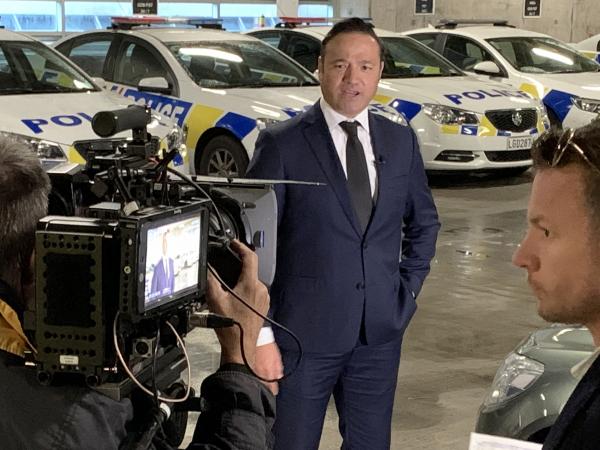 Detective Sergeant Rob Lemoto and Police Ten 7 crew filming in Wellington.