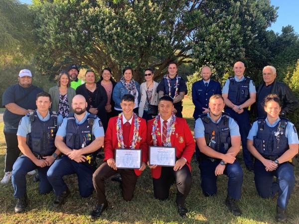 Rob and Oliver pictured with their whānau and staff from Porirua's Public Safety Team.