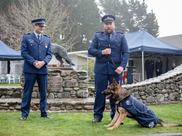 Flashback: Constable Andrew Smart (right) and Talon on graduation day with Sergeant Scott Robinson, supervisor of Coastal Dog Se