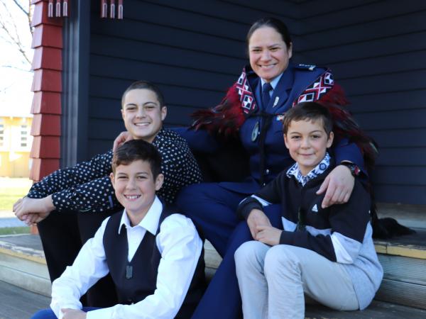 Paula with her nephews, from left, Cory, Ryan and Jared.