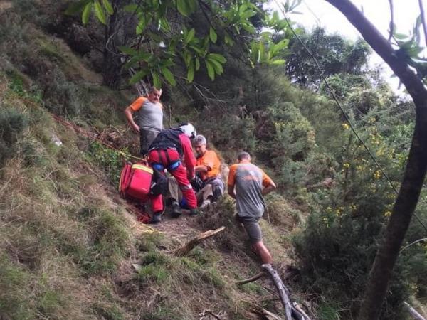 Rescue teams come to the aid of an injured hunter after a fall in Waikawa, Picton.