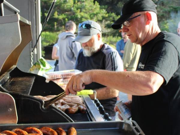 Described as a tireless worker by his colleagues, Phil always pitches in wherever needed - even on the barbecue.