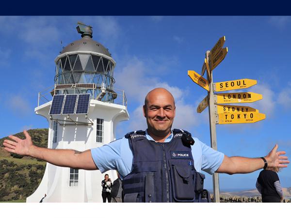 Senior Constable Leon Shepherd in front of the lighthouse at Cape Reinga