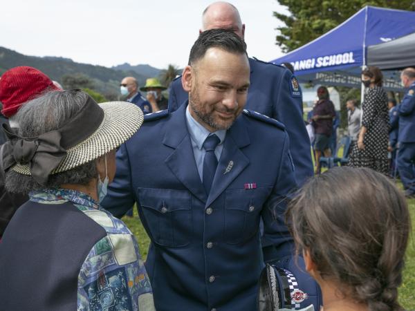 Inspector Darren Paki greets whānau at his pōhiri at Tuatini Marae in Tokomaru Bay.