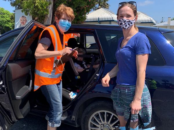 Norma Hooks from Plunket checks child restraints for a Gisborne mum.