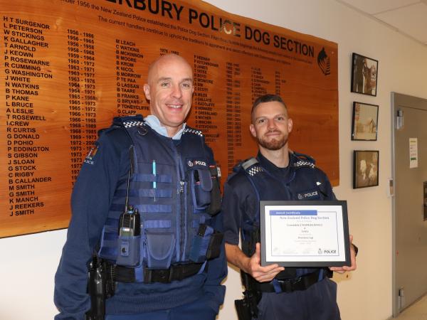 Senior Sergeant Craig Scott presents the Overton Cup certificate to Josh - the Cup is still to come.