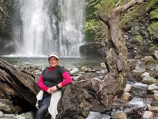 Beryl by a waterfall on the Hollyford Track.