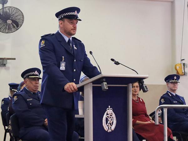 Constable White speaks to the wing and audience.