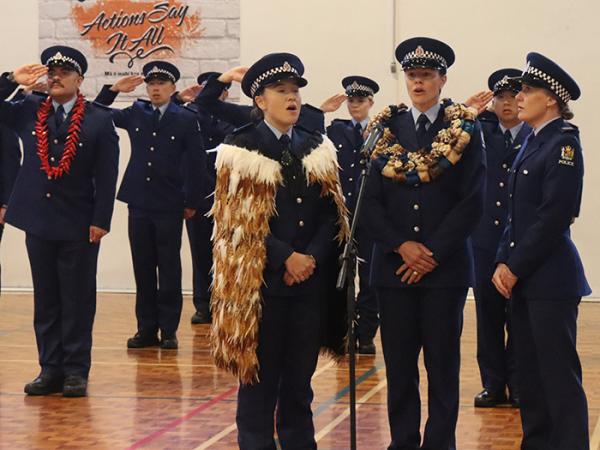 The National Anthem was sung by, from left, Constables Ariana Lander, Danielle Roche and Adele Puddy.