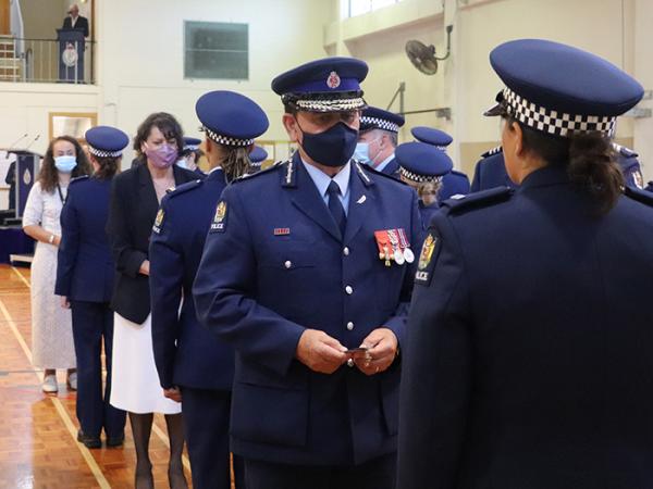 The official party presented ID cards to each new constable.