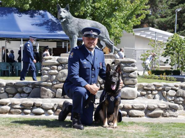 Senior Constable Comrie Keenan with Tahi at their graduation at the New Zealand Police Dog Training Centre in Trentham.