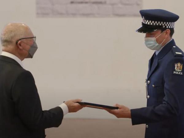 Constable Faris Petty receives his award for second in wing from Patron Phillip Green.
