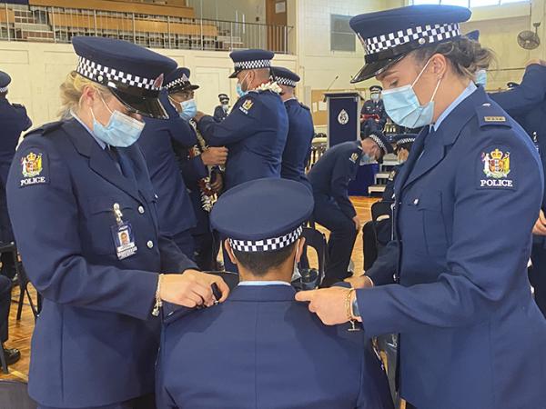 Constable epaulettes are put on at Wing 351's attestation ceremony.