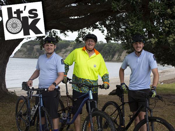 Photo of, from left, cyclists James Cox, Craig Macdonald and Cam Macdonald, with an inset imageof the It's OK logo.