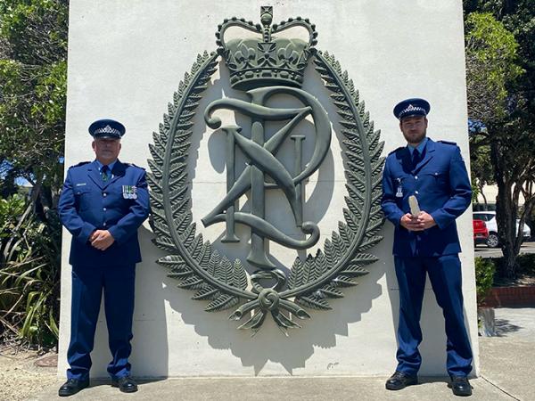 Detective Senior Sergeant Mark Moorhouse and his son Nicholas, who graduated from Police College in December.