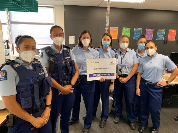Seven female WAN members in Waitematā District holding up a #BreakTheBias sign.