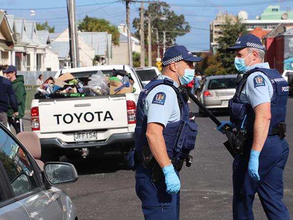 Two officers on the street during the clean up 