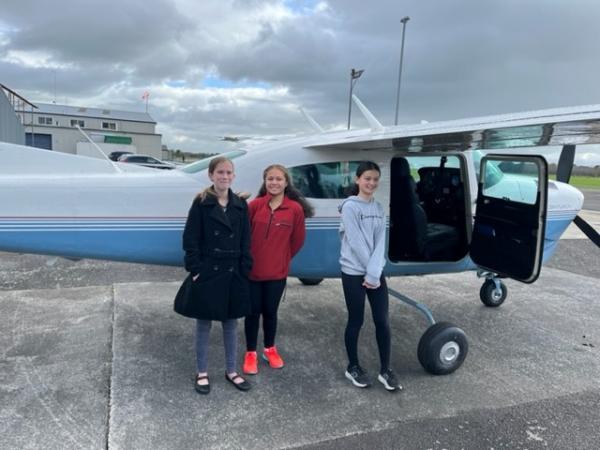 Some of the excited young passengers getting ready for their flight experience.