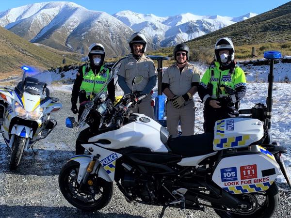 Senior Constable Mark Middleton, Sam Sinclair from FENZ, Khiry Hewitt and Sergeant Lachy Garrick.