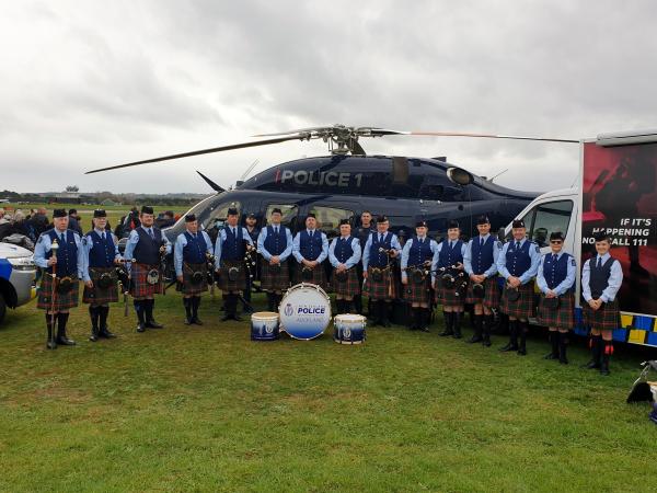The Auckland Police Pipe Band with Air Support and Deodar colleagues at Warbirds on Parade.