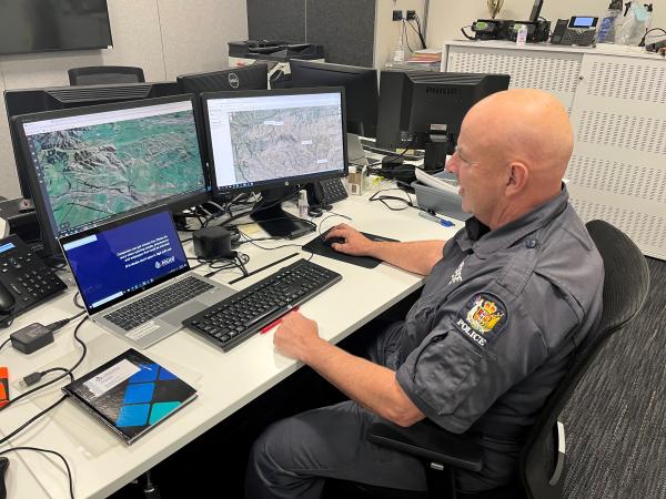 Senior Constable Rob Stokes coordinating the search from the IMT Base at Te Omeka in central Christchurch.
