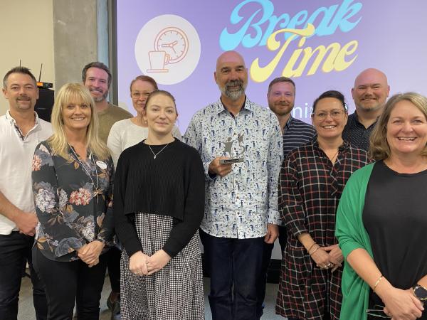 Taranaki Big Brothers Big Sisters staff and trustees with Senior Constable Paul Lampe after the presentation of his award. Back 