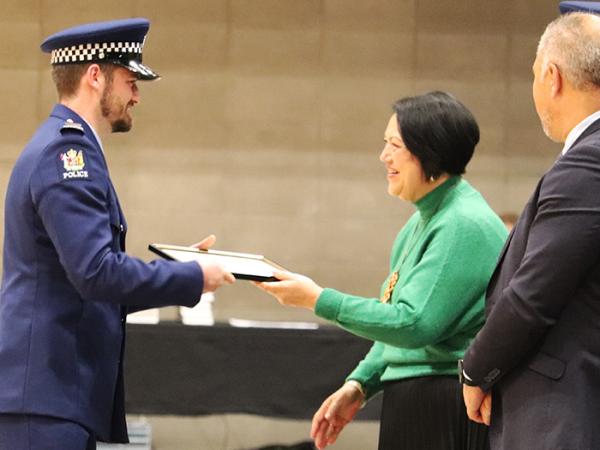Wing Patron Arihia Stirling QSM presents Second in Wing Ben Sullivan with his award.