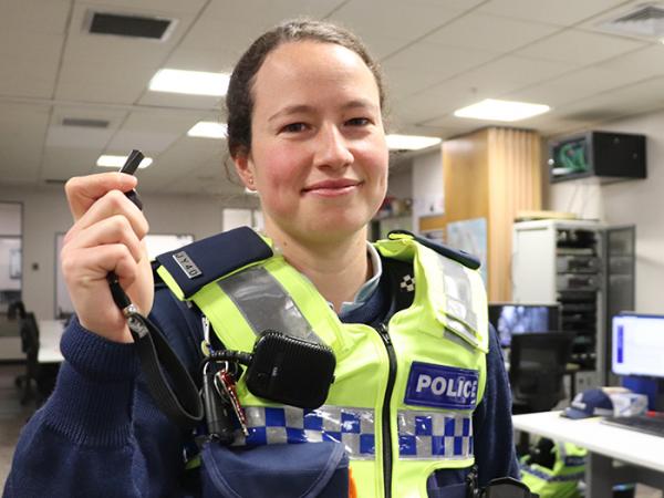 Dunedin Constable Erin Doherty holding up her referee's whistle.