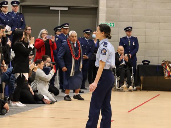 One of the kaikaranga, Constable Danielle Silich, leading the start of the haka.