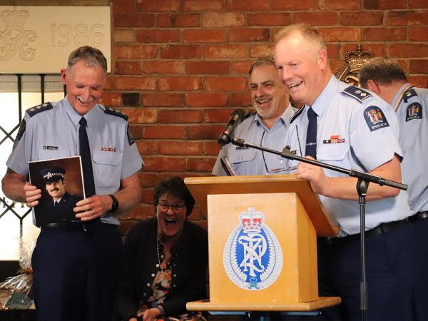 Dave and his wife Linda laughing during Canterbury District Commander John Price's speech. 