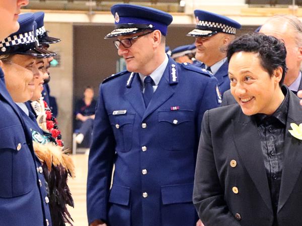 Minister of Justice Kiritapu Allan and graduates share a moment during the inspection...