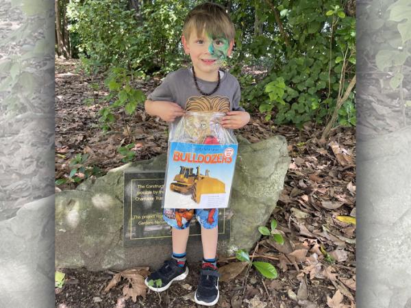 Luka with one of the books he's found.