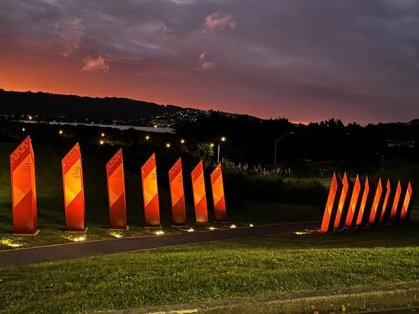 He Toa Taumata Rau lit up at night.