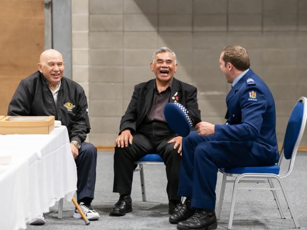 Kaumātua from the local marae share a joke with an initial training staff member