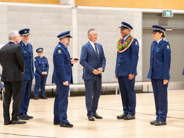 Police Commissioner Andrew Coster, second from left, and Wing Patron Mike Bush, centre, inspect the wing with others.
