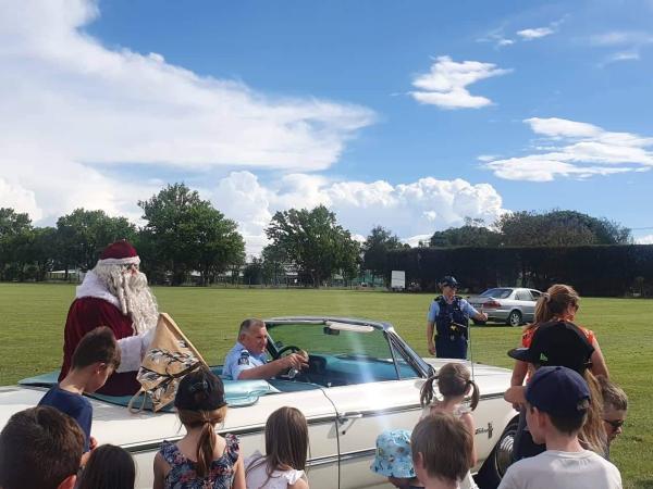 Sergeant Greg Macklow and Santa making an appearance.