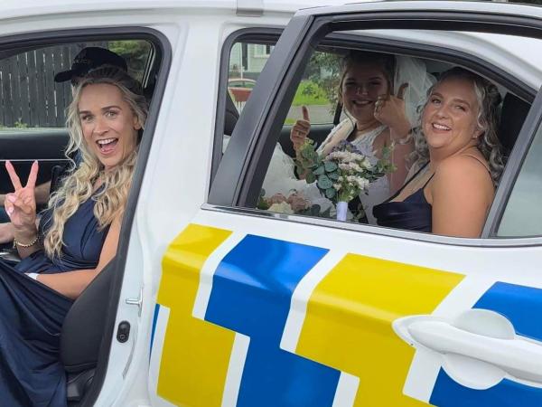 The bride and her bridesmaids were pretty stoked to be delivered to the ceremony thanks to Senior Constable Adam Groves!  