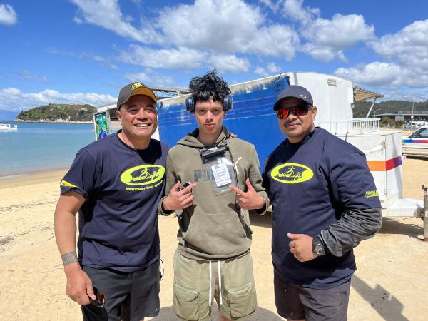 Back in Kaiteriteri - Jeremy Faumuina from New Brighton Police and Detective Aleki Maka from Nelson Bays Police with a waka adve