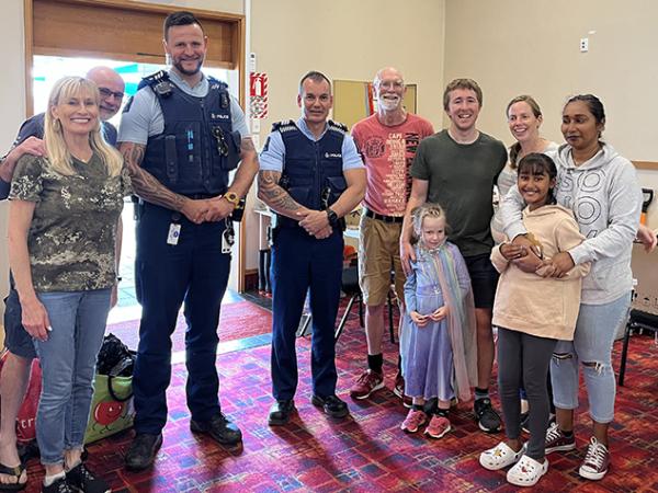 Sergeants Sean Burn (left) and Jon-Paul Tremain at Bay Baptist Church with volunteers.