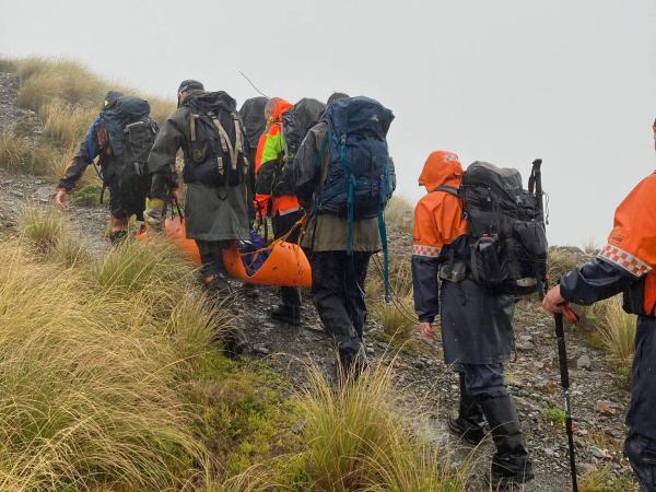 The rescue teams in action during the bad weather.